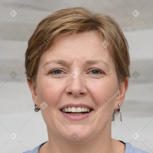 Joyful white adult female with medium  brown hair and grey eyes