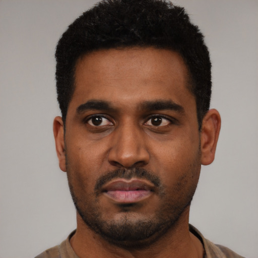 Neutral black young-adult male with short  black hair and brown eyes