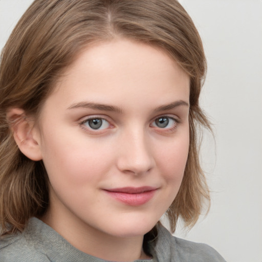 Joyful white child female with medium  brown hair and grey eyes