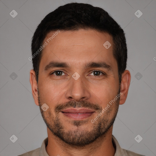 Joyful white young-adult male with short  black hair and brown eyes