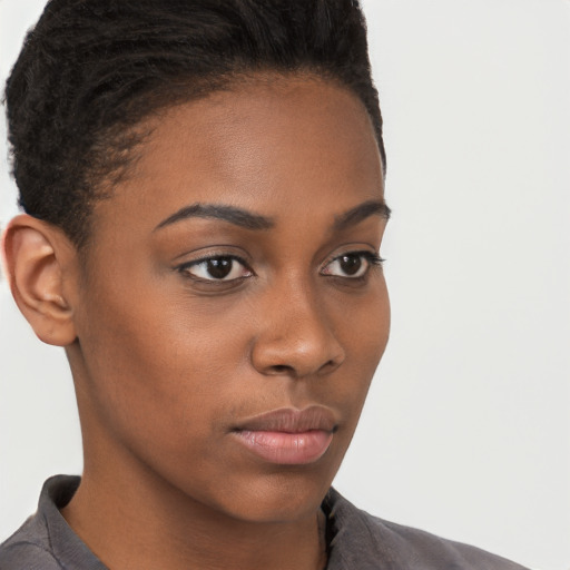 Neutral black young-adult female with short  brown hair and brown eyes