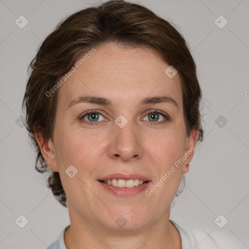 Joyful white adult female with medium  brown hair and grey eyes