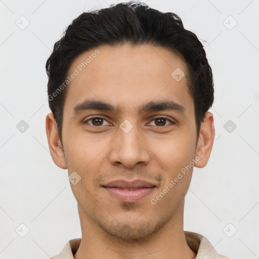 Joyful latino young-adult male with short  black hair and brown eyes