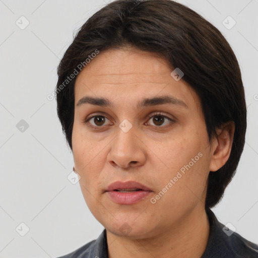 Joyful white adult female with medium  brown hair and brown eyes