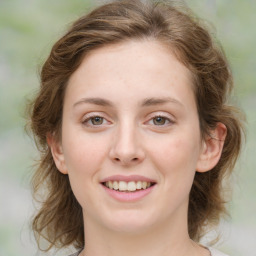 Joyful white young-adult female with medium  brown hair and green eyes