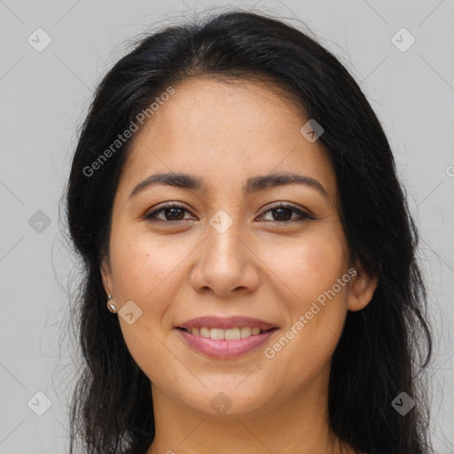 Joyful latino young-adult female with long  brown hair and brown eyes