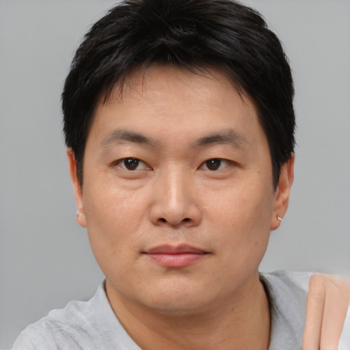 Neutral asian young-adult male with short  black hair and brown eyes