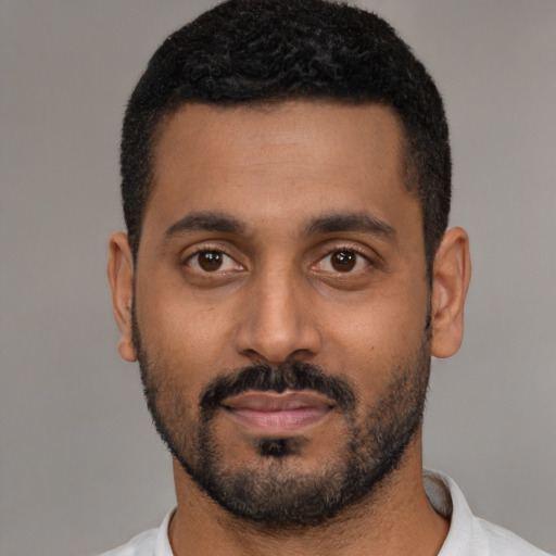 Neutral black young-adult male with short  black hair and brown eyes