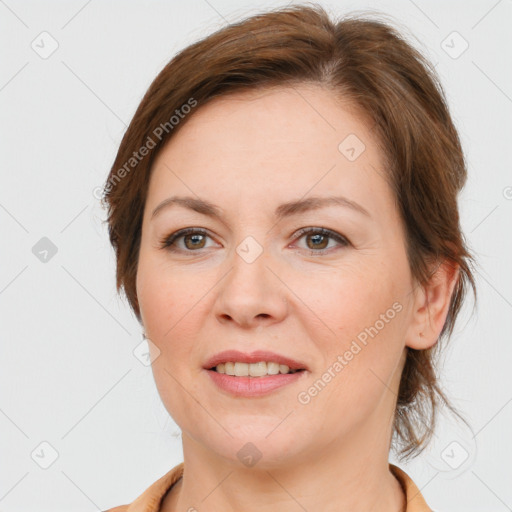 Joyful white young-adult female with medium  brown hair and grey eyes