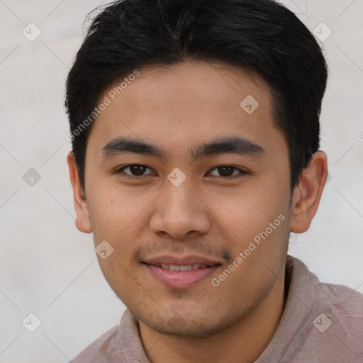 Joyful asian young-adult male with short  brown hair and brown eyes