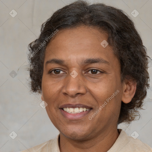 Joyful black adult female with short  brown hair and brown eyes