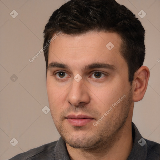 Neutral white young-adult male with short  black hair and brown eyes