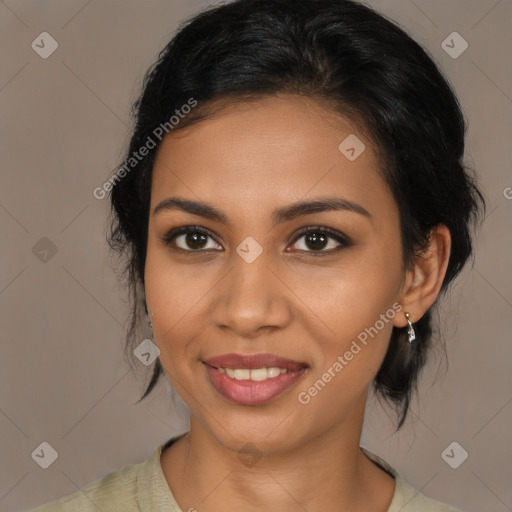 Joyful latino young-adult female with medium  brown hair and brown eyes