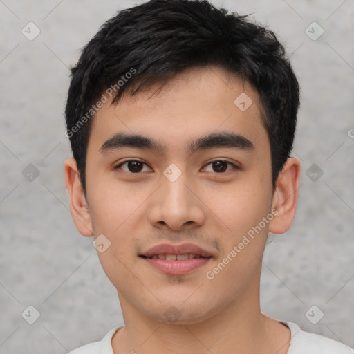 Joyful asian young-adult male with short  black hair and brown eyes