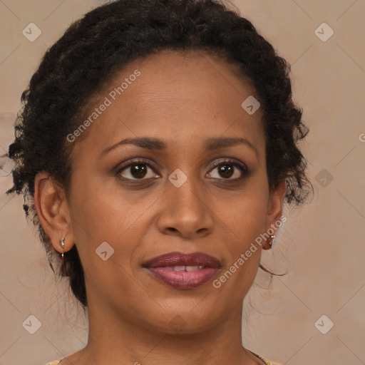 Joyful black adult female with medium  brown hair and brown eyes