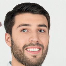 Joyful white young-adult male with short  black hair and brown eyes