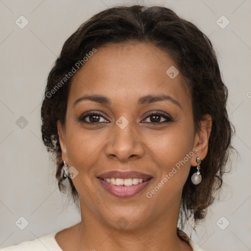 Joyful black adult female with medium  brown hair and brown eyes