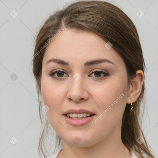 Joyful white young-adult female with medium  brown hair and green eyes