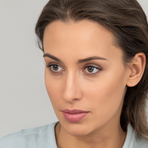 Neutral white young-adult female with medium  brown hair and brown eyes