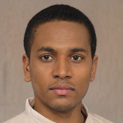 Neutral latino young-adult male with short  brown hair and brown eyes