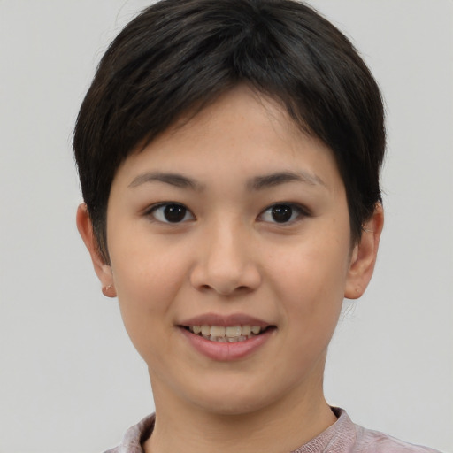 Joyful asian young-adult female with short  brown hair and brown eyes