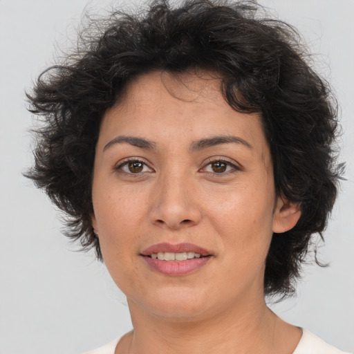 Joyful white adult female with short  brown hair and brown eyes