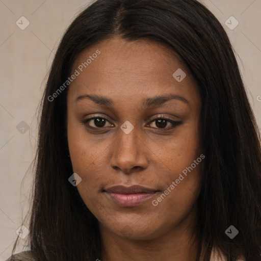 Joyful black young-adult female with long  brown hair and brown eyes