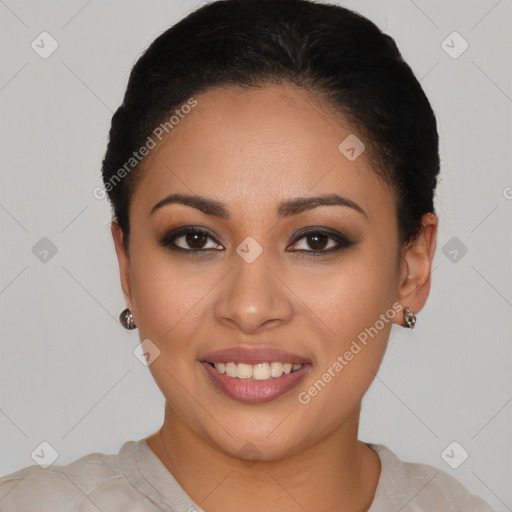 Joyful latino young-adult female with short  black hair and brown eyes