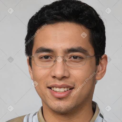 Joyful asian young-adult male with short  black hair and brown eyes