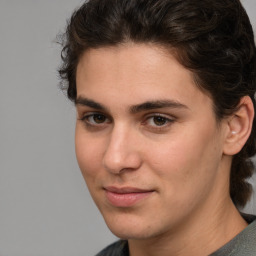 Joyful white young-adult male with medium  brown hair and brown eyes