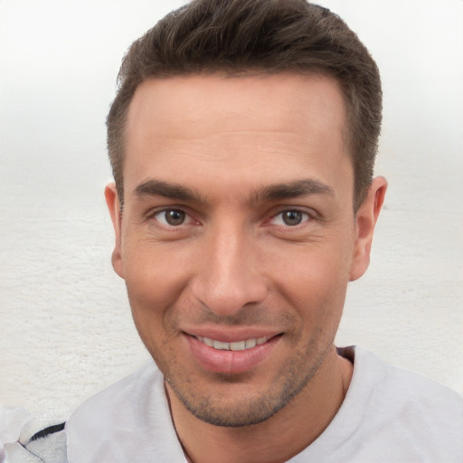 Joyful white young-adult male with short  brown hair and brown eyes