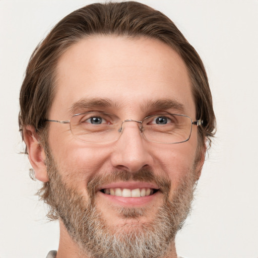 Joyful white adult male with short  brown hair and grey eyes