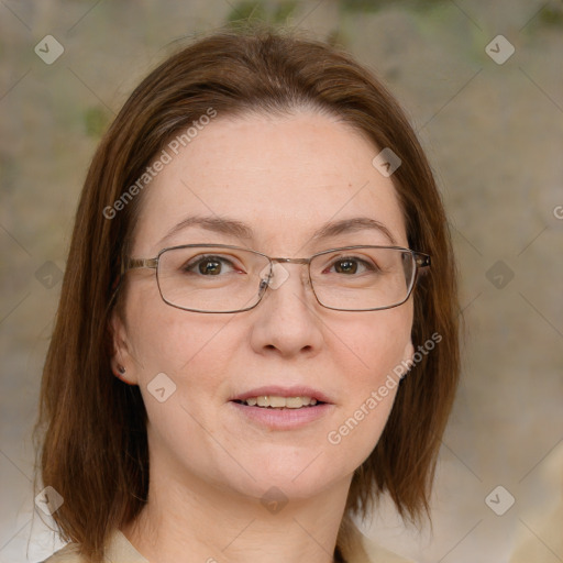 Joyful white adult female with medium  brown hair and green eyes