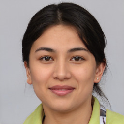 Joyful asian young-adult female with medium  brown hair and brown eyes