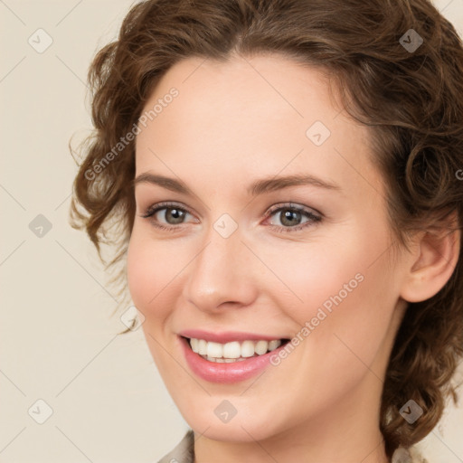 Joyful white young-adult female with medium  brown hair and green eyes