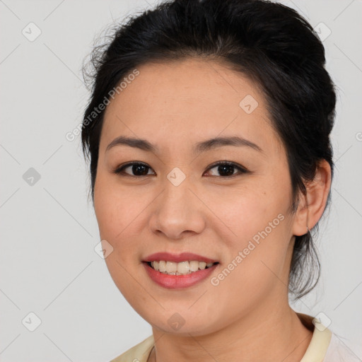 Joyful asian young-adult female with medium  brown hair and brown eyes