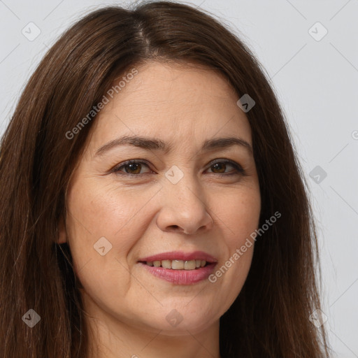 Joyful white adult female with long  brown hair and brown eyes