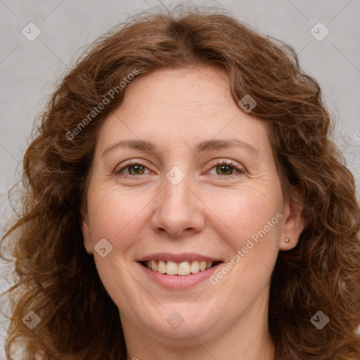 Joyful white adult female with long  brown hair and brown eyes