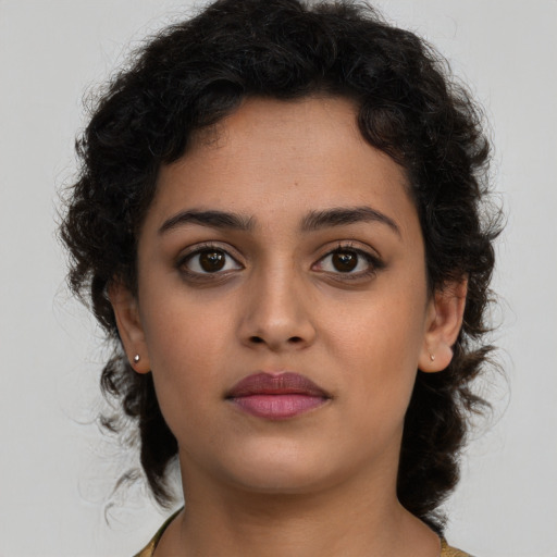 Neutral latino young-adult female with medium  brown hair and brown eyes