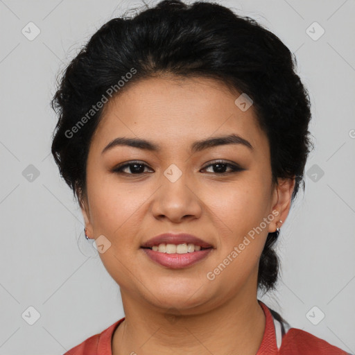 Joyful latino young-adult female with short  black hair and brown eyes