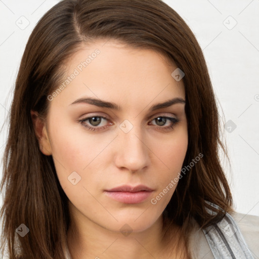 Neutral white young-adult female with long  brown hair and brown eyes