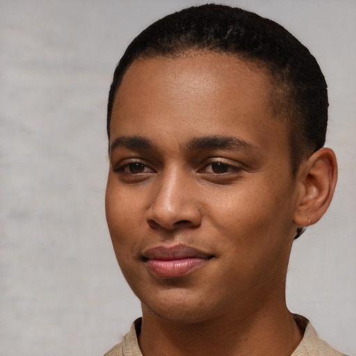 Joyful black young-adult male with short  black hair and brown eyes