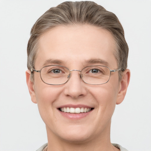 Joyful white adult male with short  brown hair and grey eyes