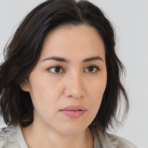Neutral asian young-adult female with medium  brown hair and brown eyes