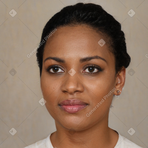 Joyful black young-adult female with short  black hair and brown eyes