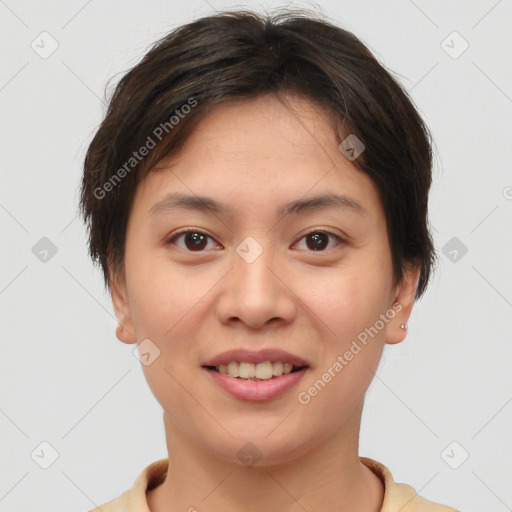 Joyful asian young-adult female with short  brown hair and brown eyes