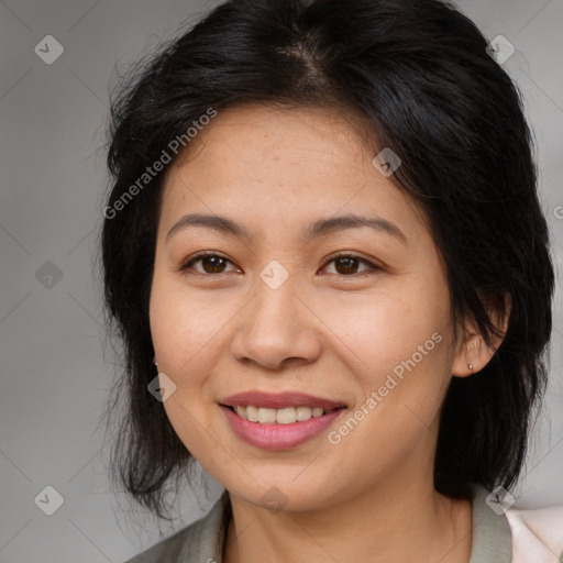 Joyful asian young-adult female with medium  brown hair and brown eyes