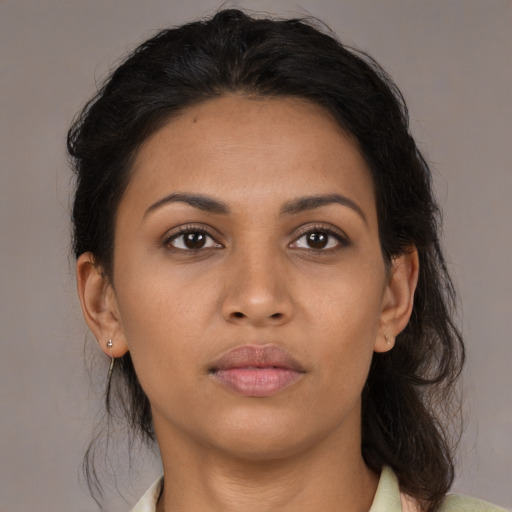 Neutral latino young-adult female with medium  brown hair and brown eyes