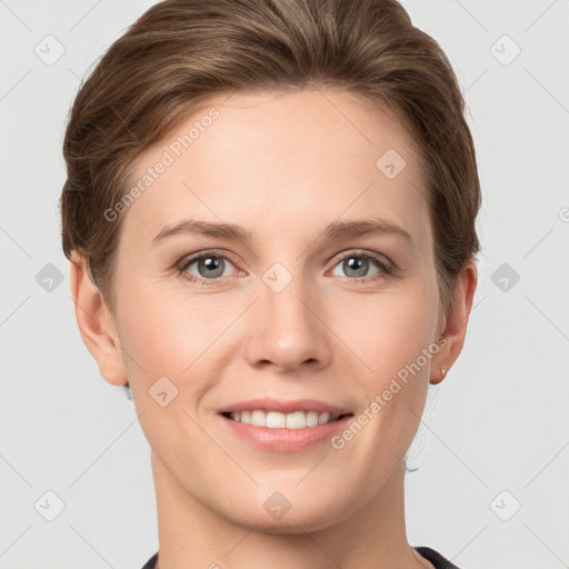 Joyful white young-adult female with short  brown hair and grey eyes