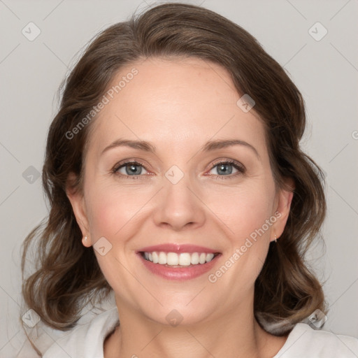 Joyful white young-adult female with medium  brown hair and green eyes